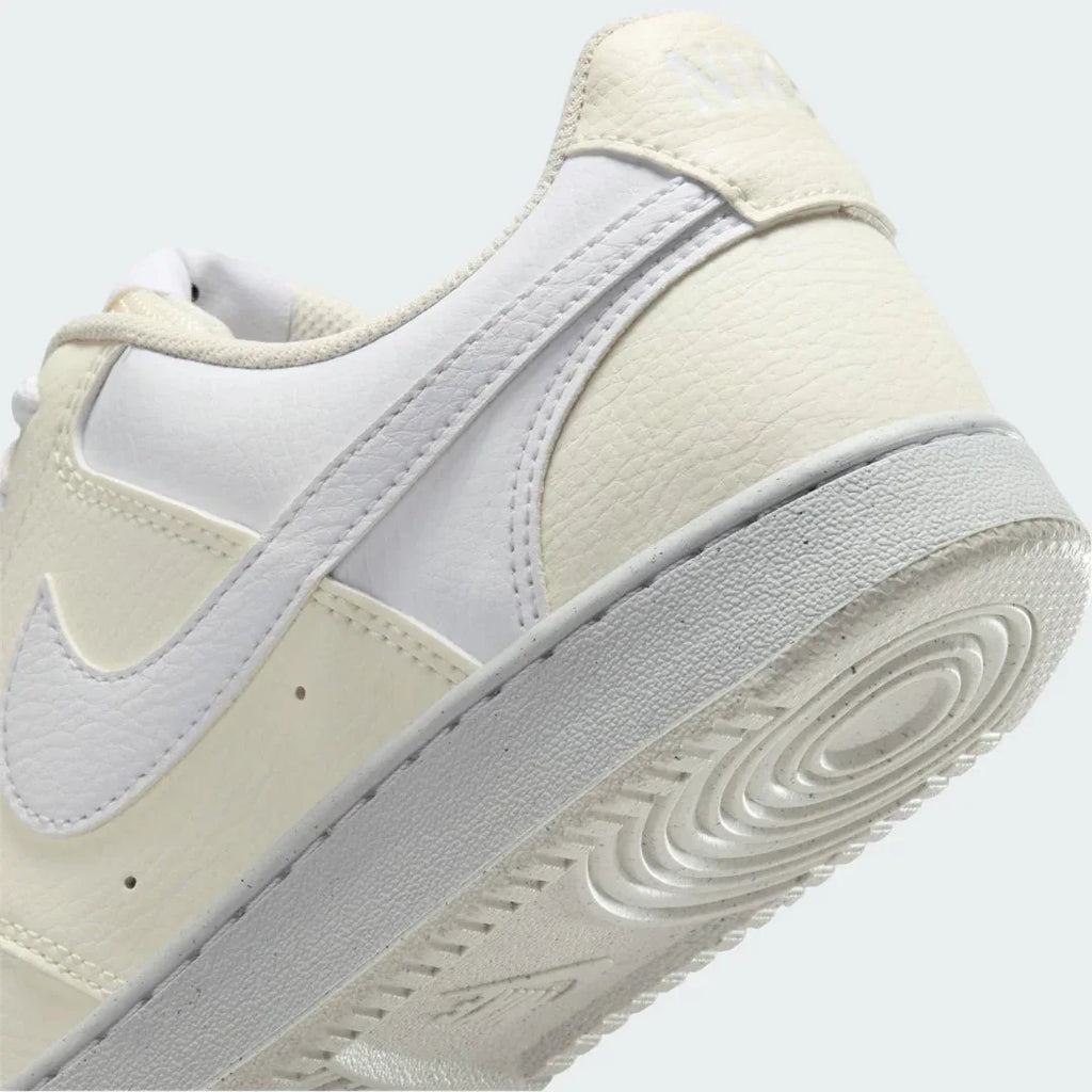Detailed zoom on the outsole and midsole of the Nike Court Vision Lo Next Nature Women's white trainers, highlighting the classic rubber cupsole construction.