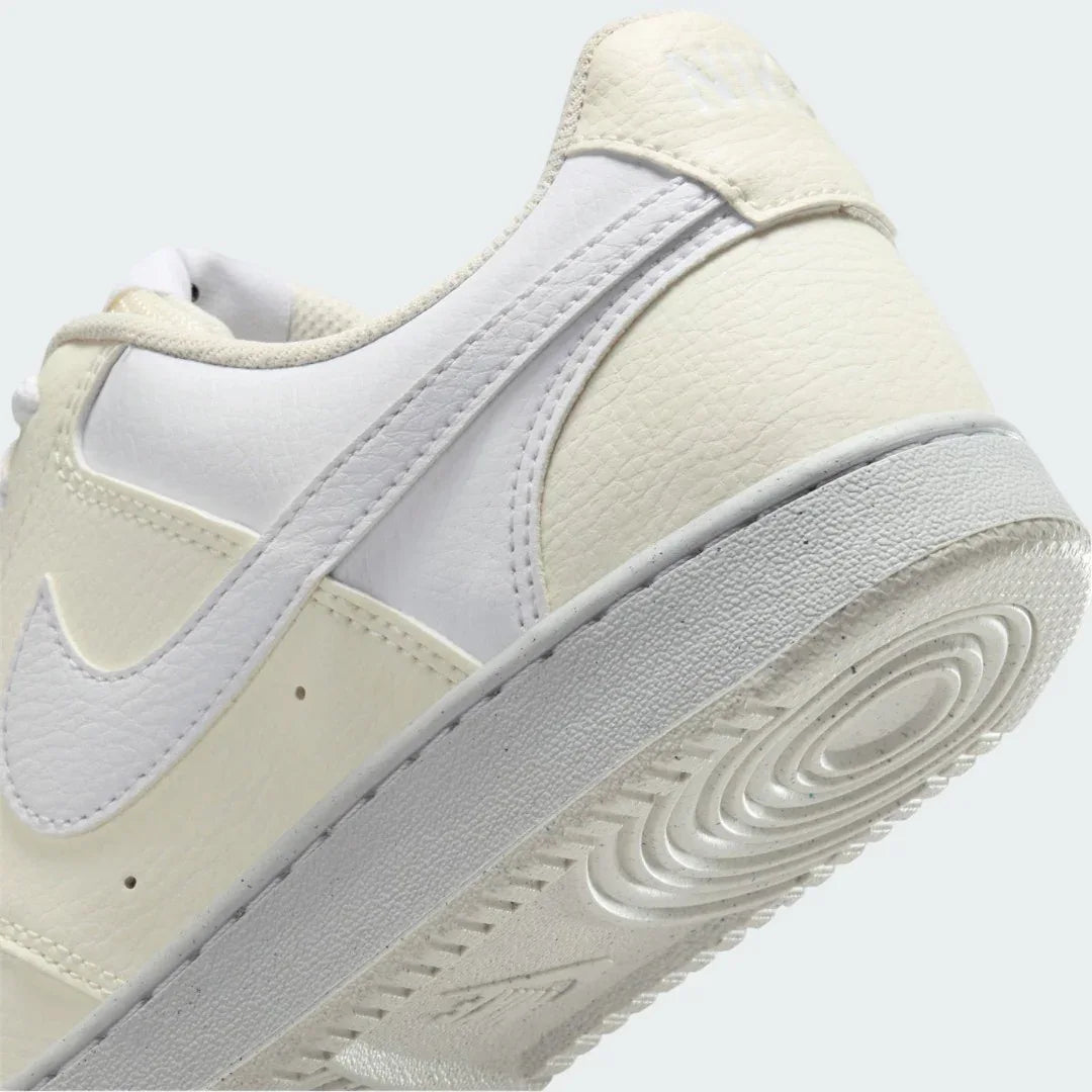 Detailed zoom on the outsole and midsole of the Nike Court Vision Lo Next Nature Women's white trainers, highlighting the classic rubber cupsole construction.