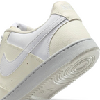 Detailed zoom on the outsole and midsole of the Nike Court Vision Lo Next Nature Women's white trainers, highlighting the classic rubber cupsole construction.