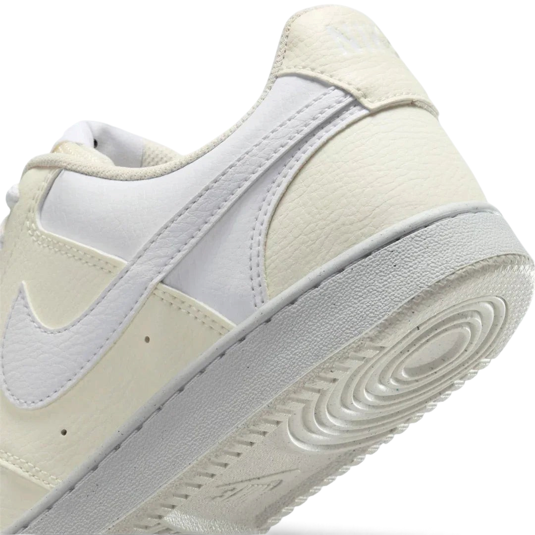 Detailed zoom on the outsole and midsole of the Nike Court Vision Lo Next Nature Women's white trainers, highlighting the classic rubber cupsole construction.