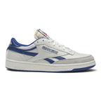 Medial profile view of the Reebok Club C Revenge Vintage sneaker highlighting the chalk white leather upper, collegiate royal vector overlays, perforated toe box, and blue rubber outsole on a clean white background.