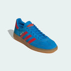 Angled side view of adidas Handball Spezial Men's shoes highlighting bold colour and classic shape