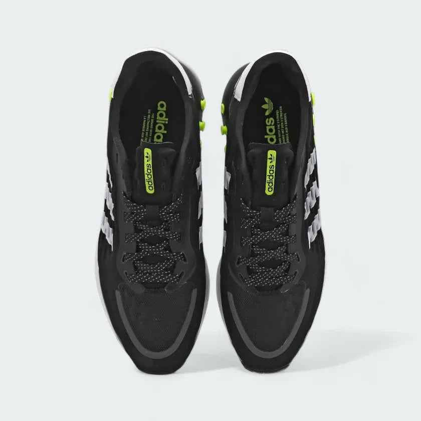 Top-Down View of Pair: Focuses on the monogram tongue detail and the unique spot-design laces.