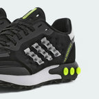 Angle View Showing Both Pair Side by Side: Captures the 3-Stripes branding and the high-contrast yellow and black colour blocking.