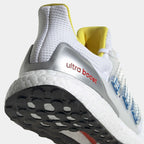 Detailed zoom on the outsole and midsole of the Adidas Ultraboost DNA x Lego Men's trainers, highlighting the Boost cushioning pellets and rubber tread.