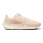 Highlights the streamlined lateral profile showing the Pale Ivory engineered mesh upper, Pink Oxford outlined Nike Swoosh, matching eyestay panel, sculpted React foam midsole stamped with subtle Air Zoom branding, and multi-toned rubber outsole.