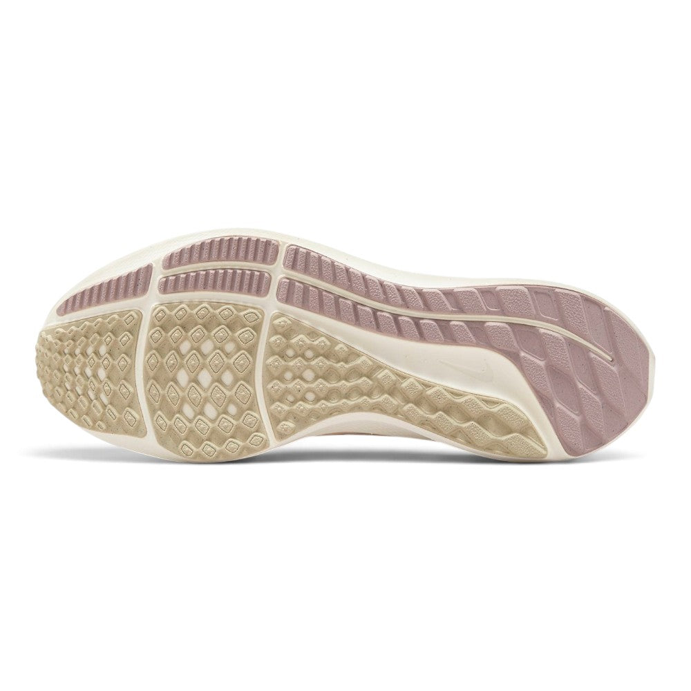Displays the full-length Pale Ivory and Pink Oxford rubber outsole, showcasing the siped waffle traction pattern, deep longitudinal flex grooves, and debossed Nike branding.