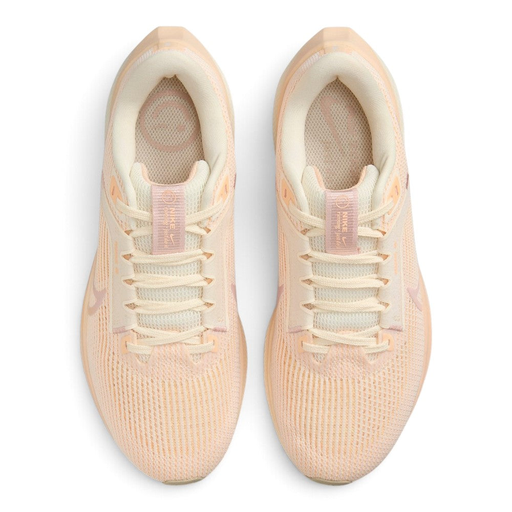 Focuses on the locked-in central lacing layout, displaying flat cream laces, padded mesh tongues with Pink Oxford branded tabs, cushioned collars, and soft insoles printed with circular pinwheel graphics.