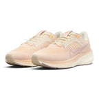 Emphasising the low-slung, athletic road-running stance and the soft, elegant tonal harmony between the Pale Ivory mesh chassis and Pink Oxford structural details.