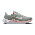 Nike Air Winflo 10 Women's running shoes in green with white accents, side profile showing engineered mesh upper, prominent Nike Swoosh, and cushioned Air midsole.