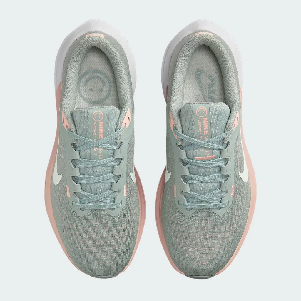 Top-down view of a pair of Nike Air Winflo 10 Women's running shoes in green, highlighting their streamlined silhouette and lace-up closure.