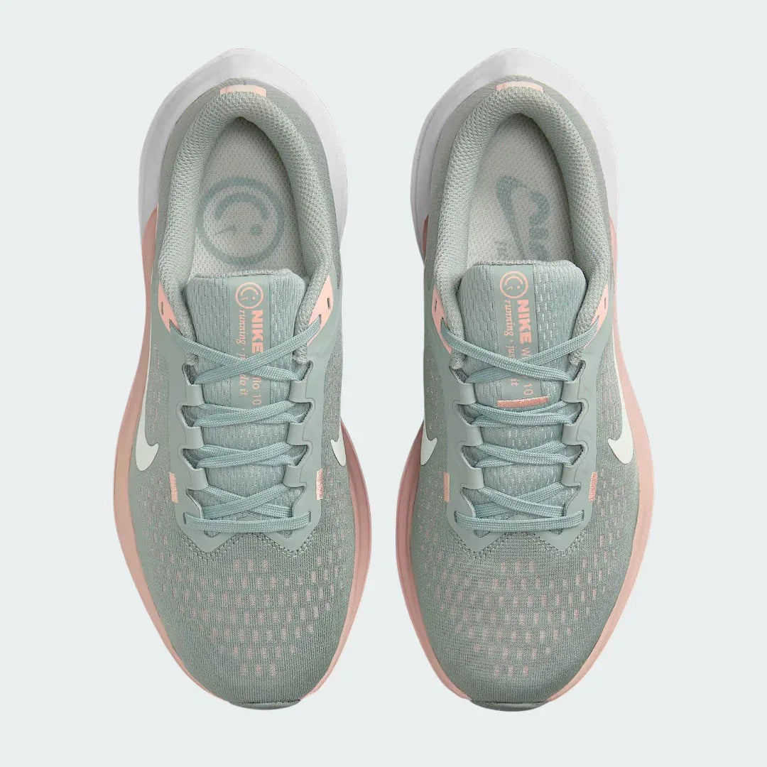 Top-down view of a pair of Nike Air Winflo 10 Women's running shoes in green, highlighting their streamlined silhouette and lace-up closure.