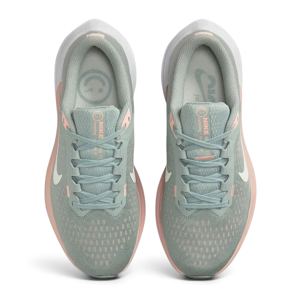 Top-down view of a pair of Nike Air Winflo 10 Women's running shoes in green, highlighting their streamlined silhouette and lace-up closure.
