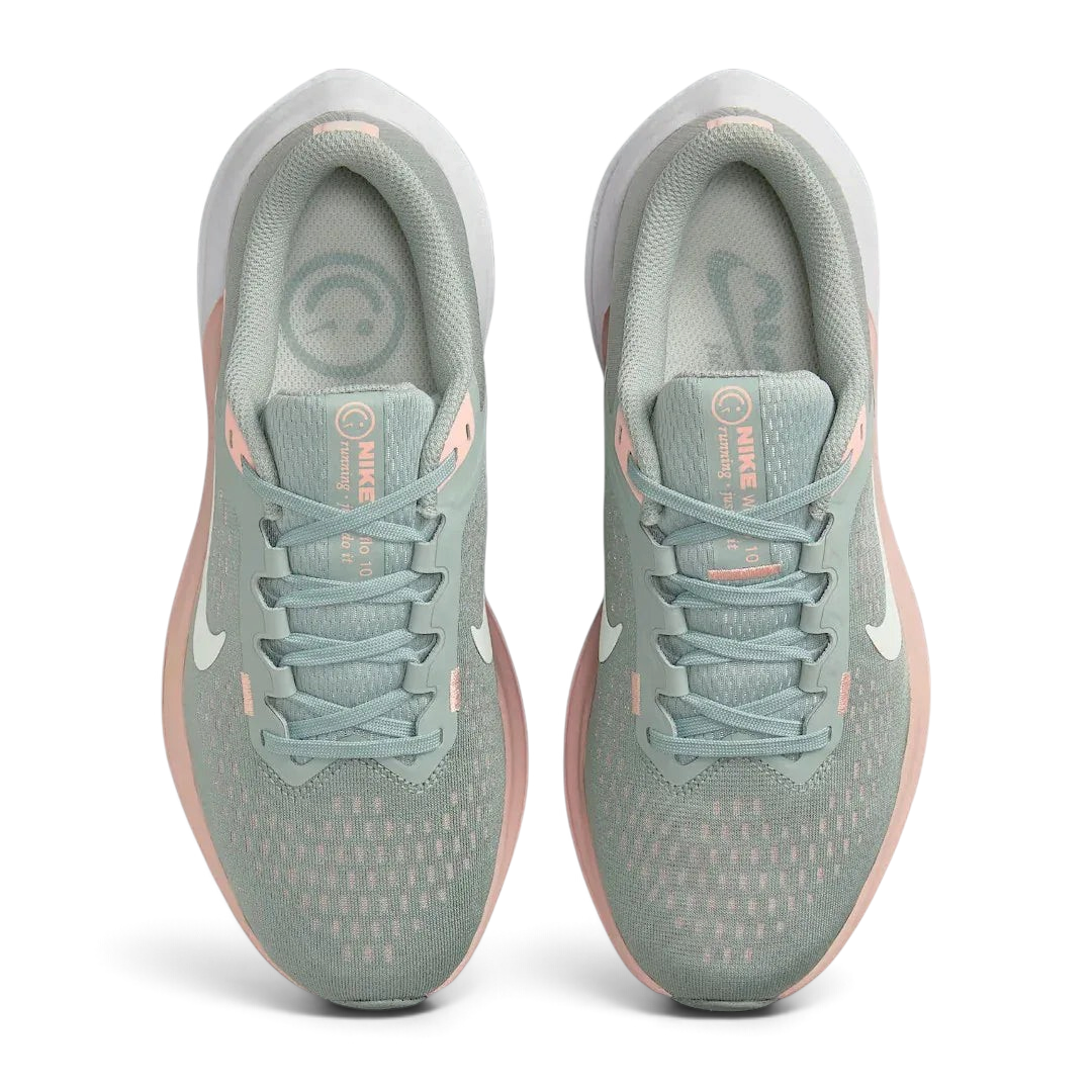 Top-down view of a pair of Nike Air Winflo 10 Women's running shoes in green, highlighting their streamlined silhouette and lace-up closure.