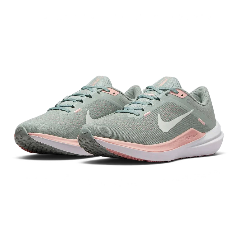 Angled view of two Nike Air Winflo 10 Women's green running shoes, side by side, showcasing their versatile design and cushioned profile.