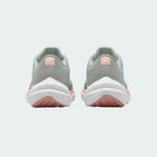 Rear view of the Nike Air Winflo 10 Women's green running shoes, focusing on the supportive heel collar and design.