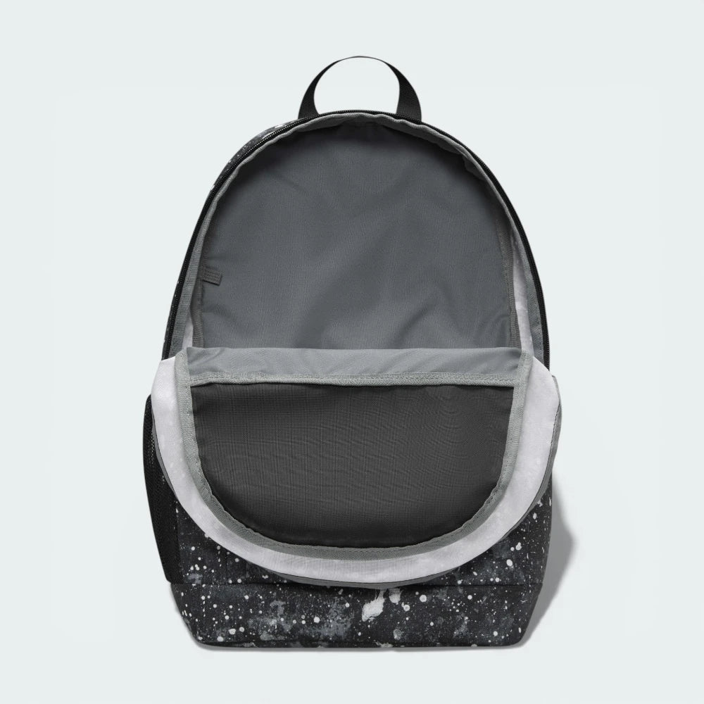 View of the interior lining of the main compartment, showing the spacious storage area for books and large gear.