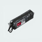 Detailed zoom on the detachable pencil case and the clip mechanism, emphasizing the convenient storage for writing utensils.