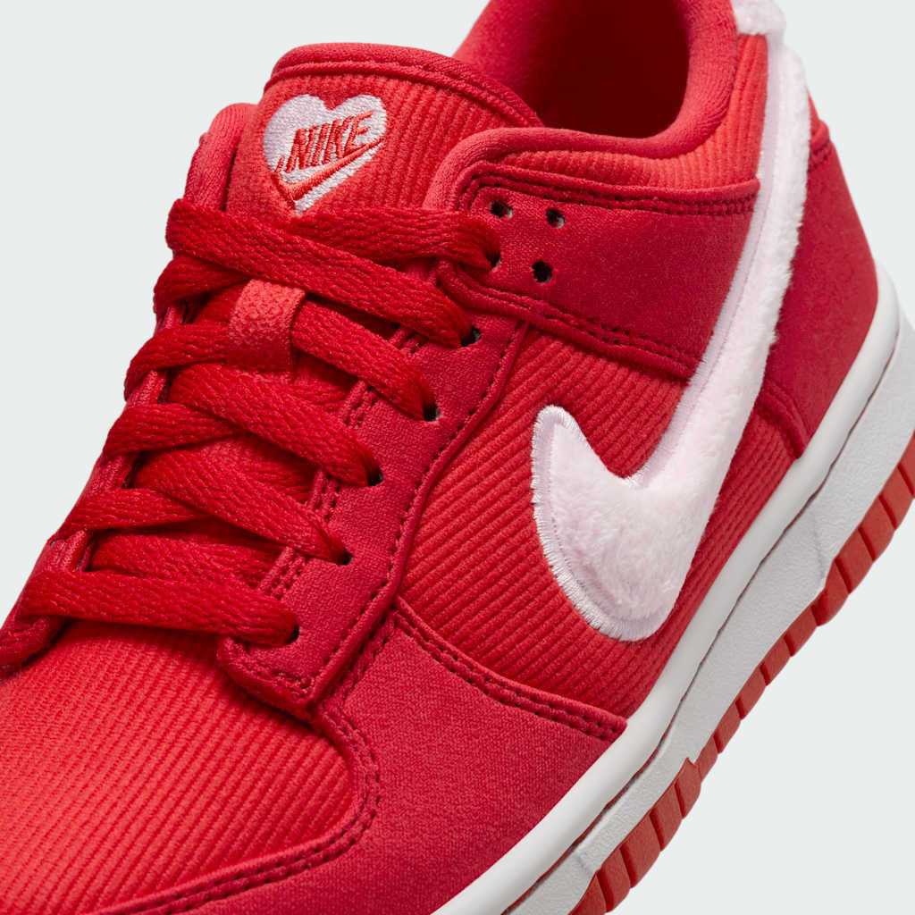 Close-up of Nike Dunk Low Valentine's Juniors Trainers FZ3548-612 laces, perforated toe box, and tongue detail