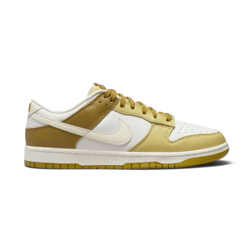 Nike Dunk Low Retro Men's sneakers in bronze leather with off-white accents, side profile showing classic leather upper, Swoosh, and midsole.