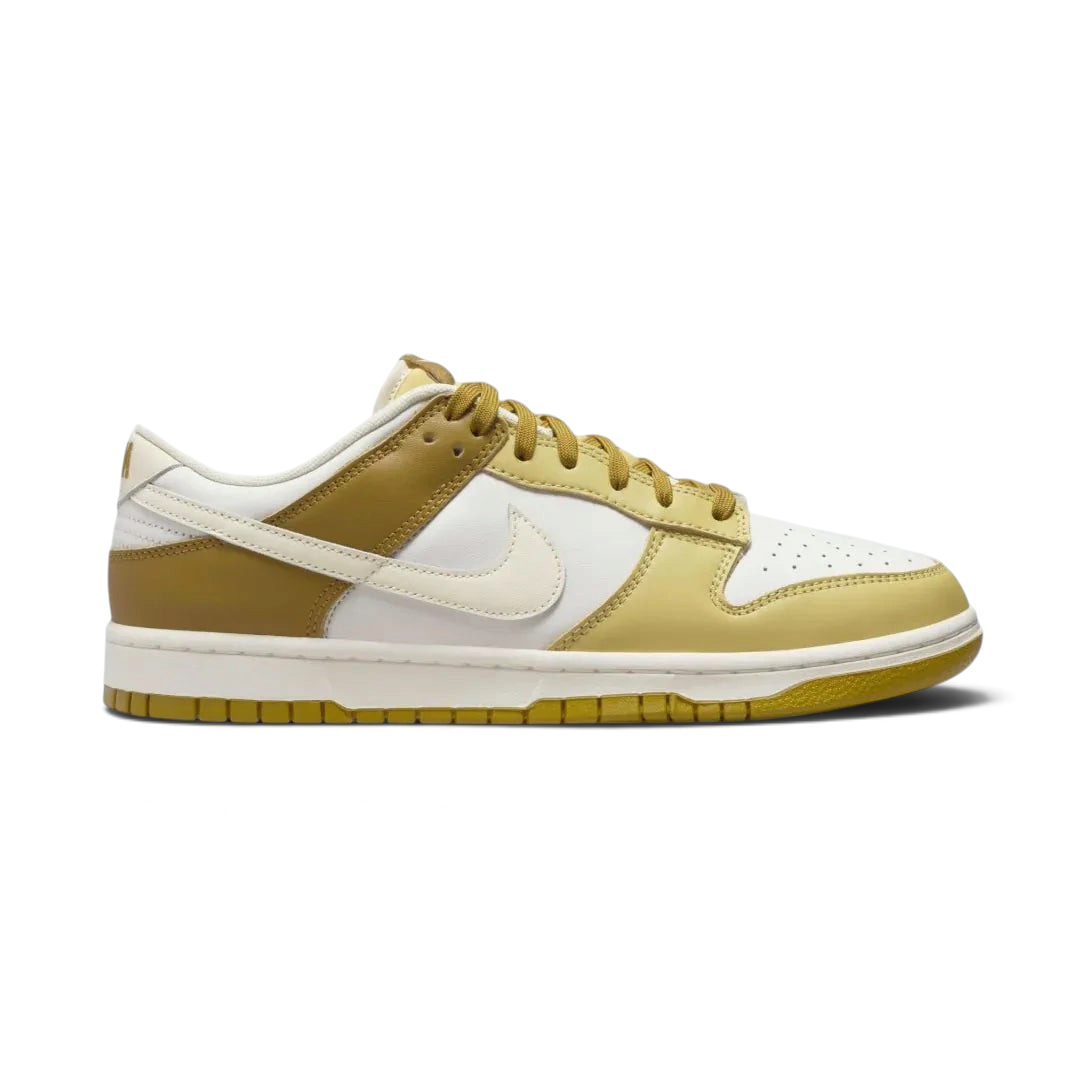 Nike Dunk Low Retro Men's sneakers in bronze leather with off-white accents, side profile showing classic leather upper, Swoosh, and midsole.