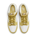 Top-down view of a pair of Nike Dunk Low Retro Men's sneakers in bronzine and coconut milk, highlighting their iconic silhouette and lace-up closure.