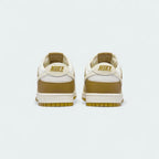 Rear view of the Nike Dunk Low Retro Men's bronze sneakers, focusing on the contrasting heel tab and Nike branding.