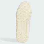 View of the outsole of the Adidas x Ivy Park Forum Low women's trainers, showing the durable rubber sole and classic traction pattern.