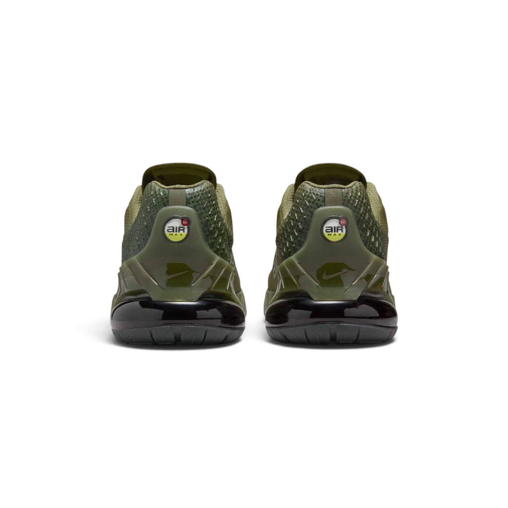 Rear-angle studio shot focusing on the molded olive heel counter featuring circular Air Max branding badges and curved structural ribs.