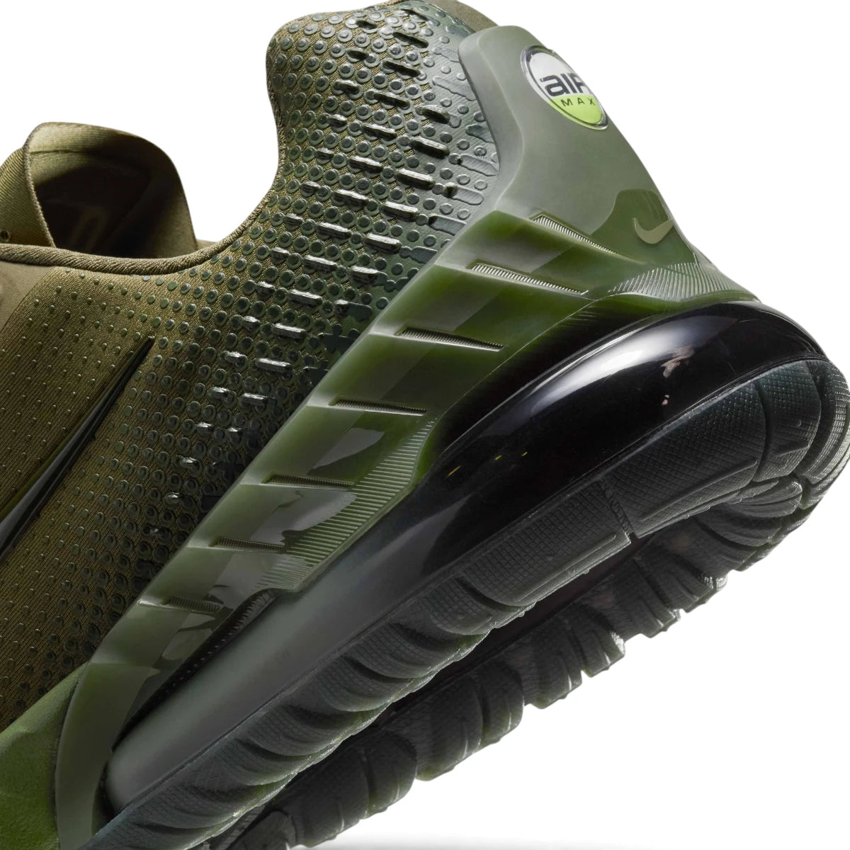Macro focus on the translucent tinted Max Air heel cushioning bubble and the rugged textured heel counter.