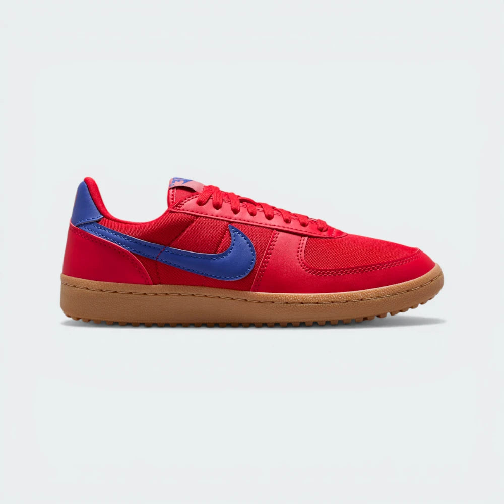 The University Red Field General, highlighting the Deep Night navy Swoosh and the contrast of the Gum Medium Brown Waffle sole.