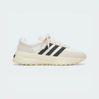 Side Profile Image: The Cream White L.A. Trainer, highlighting the iconic wavy midsole and the subtle tonal Three Stripes.