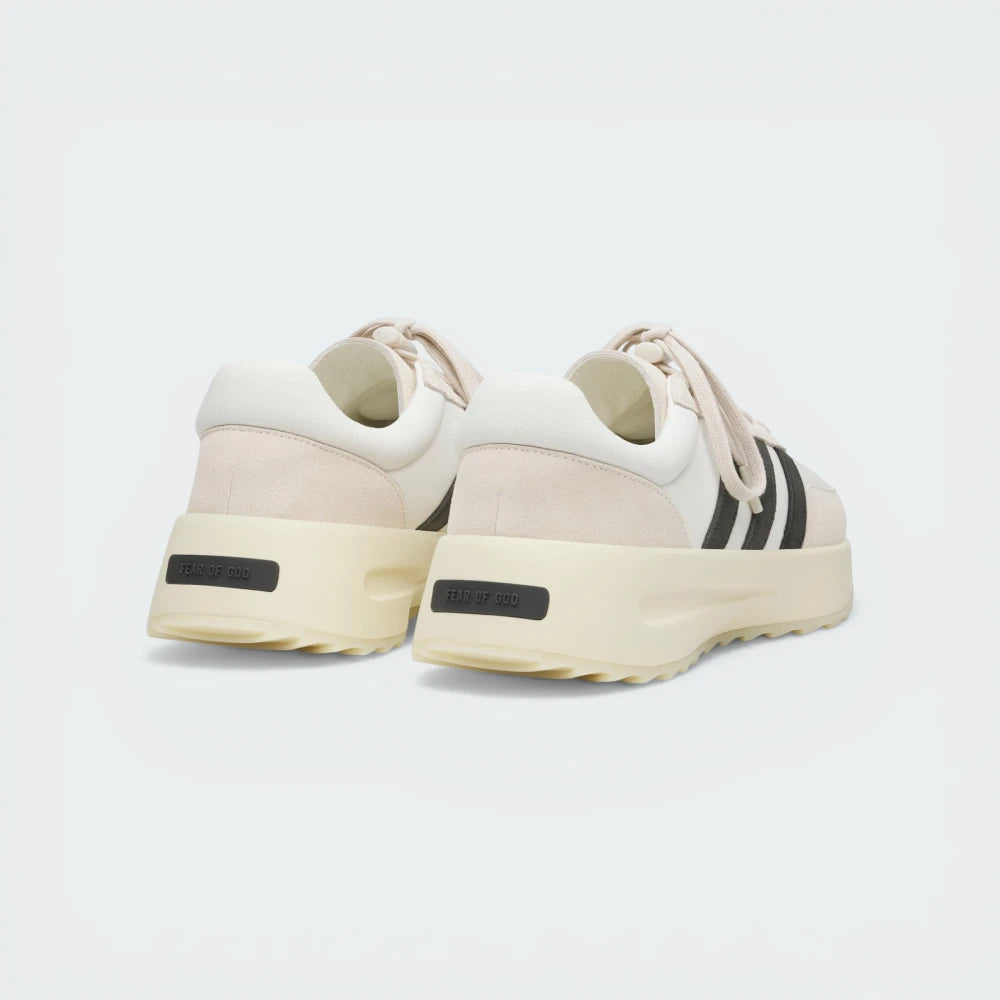 View from Behind Looking at the Heel: Focusing on the Fear of God branding on the heel bumper and the clean transition of the wavy sole.