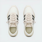 Top-Down View of Pair: Looking down at the technical lace toggle and the premium suede toe box.