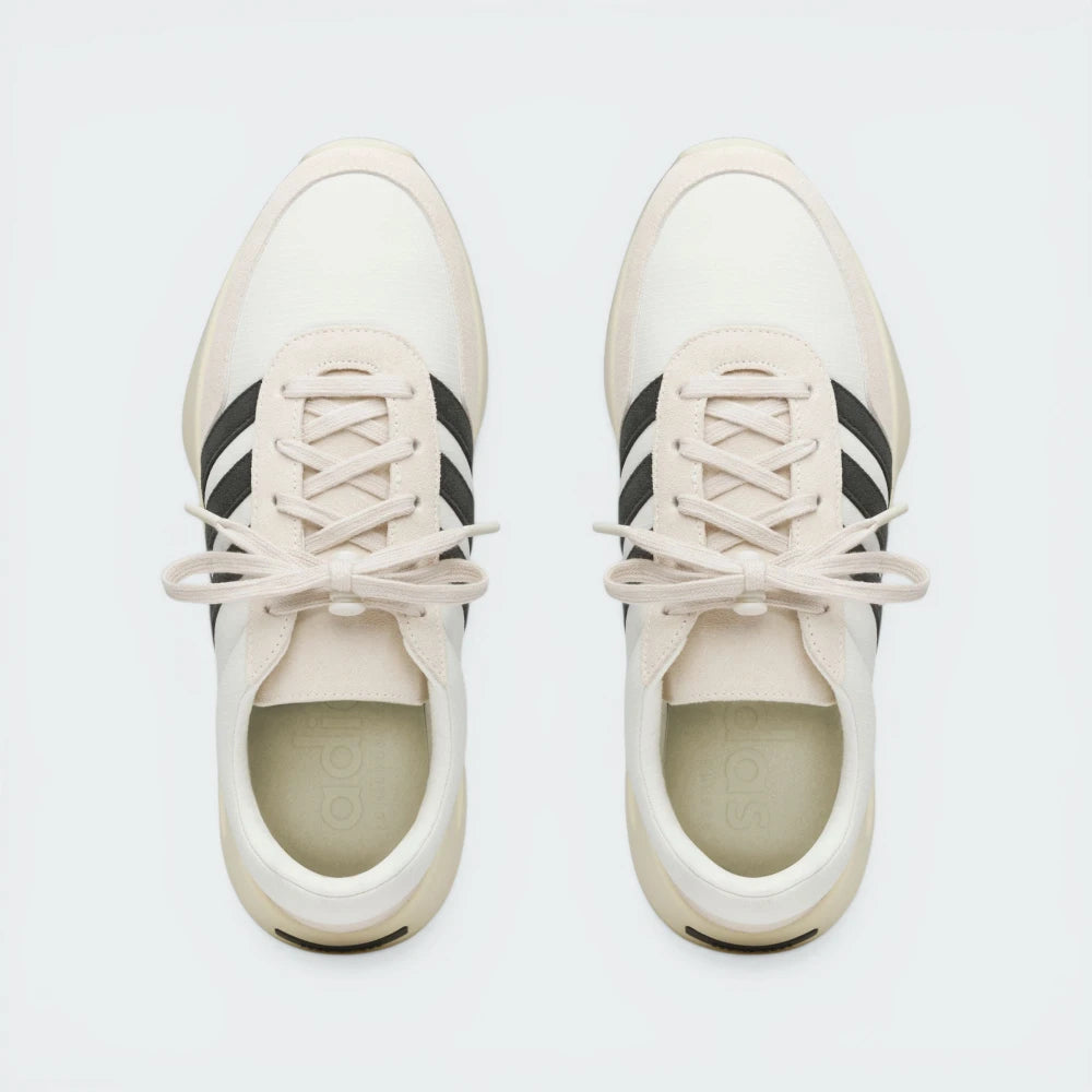 Top-Down View of Pair: Looking down at the technical lace toggle and the premium suede toe box.