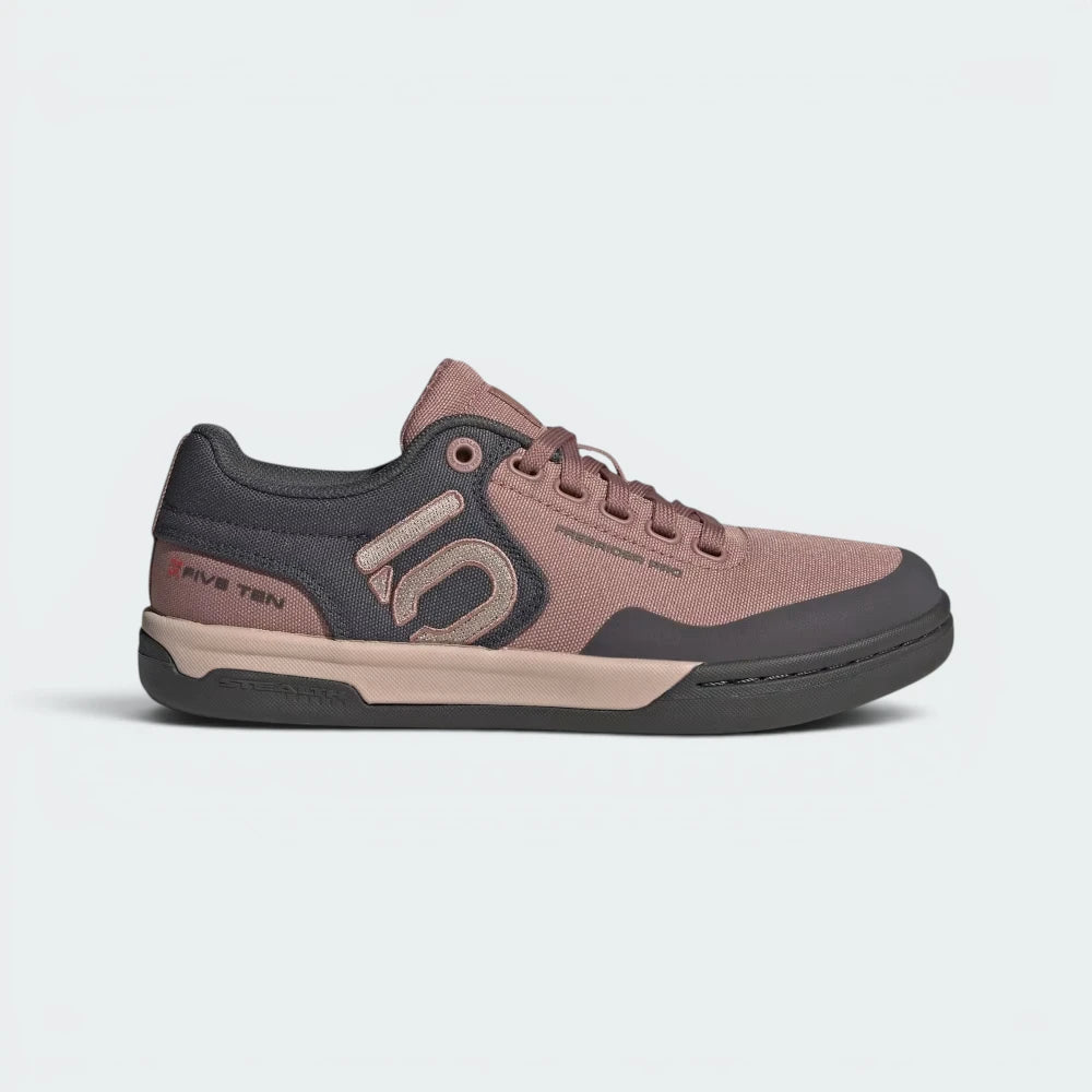 Highlights the high-velocity sweep of the classic Grey Six side stripes, showing the professional, texturized weave of the Warm Clay canvas body resting above the clean, streamlined low-profile midsole. Main image