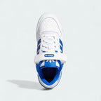 Top-down view of a pair of Adidas Forum Low Juniors' trainers in white with royal blue accents, highlighting their classic silhouette and lace-up closure.