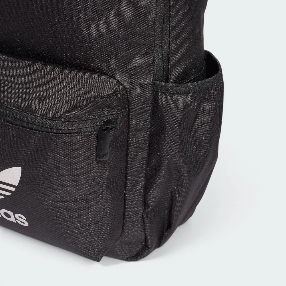 Black Adidas backpack with a white logo on a light gray background