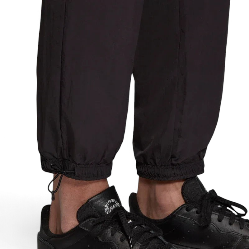 Detailed zoom on the elastic waistband with drawcord or the cuffs of the Adidas Tolima 02 Men's Track Pants, highlighting the material finish.