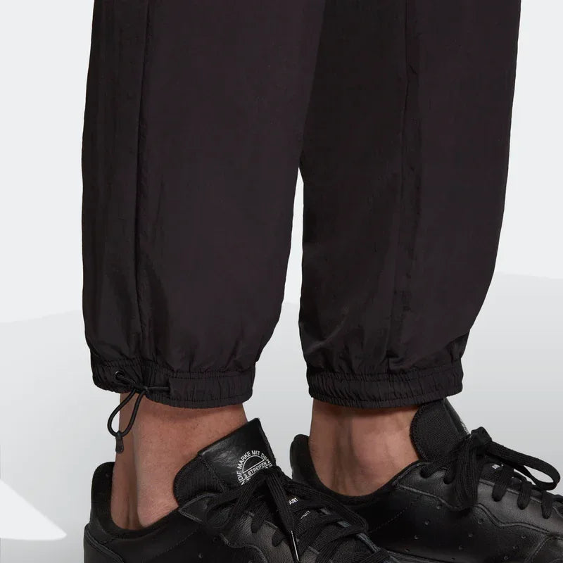 Detailed zoom on the elastic waistband with drawcord or the cuffs of the Adidas Tolima 02 Men's Track Pants, highlighting the material finish.