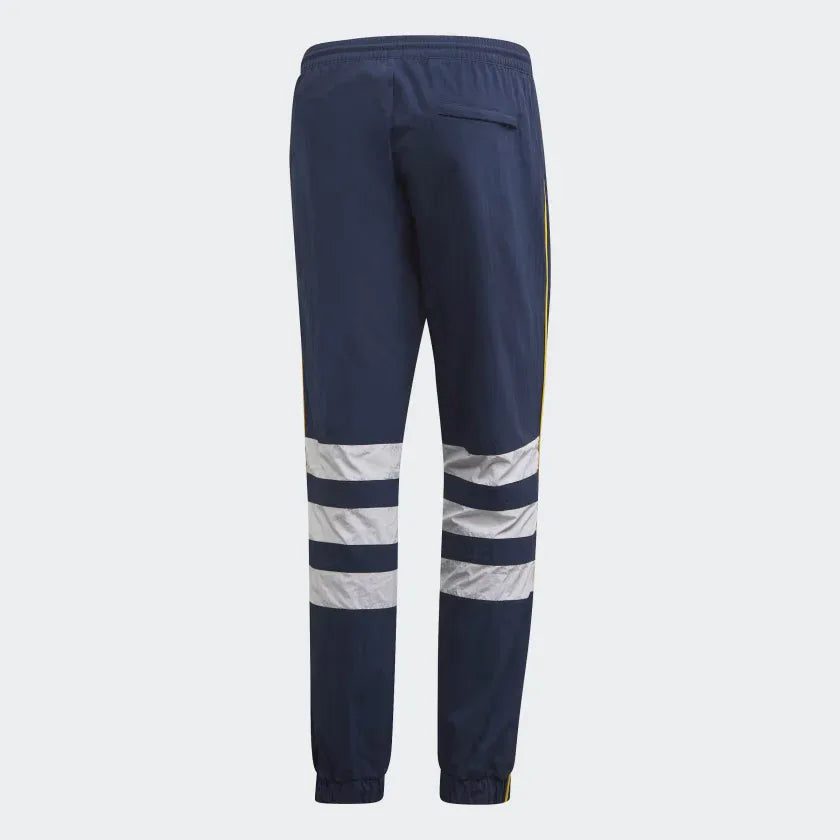 Adidas Arsenal 91-93 Track Pants Men's in collegiate navy, back view showcasing the plain design and ribbed cuffs (or zippered cuffs).
