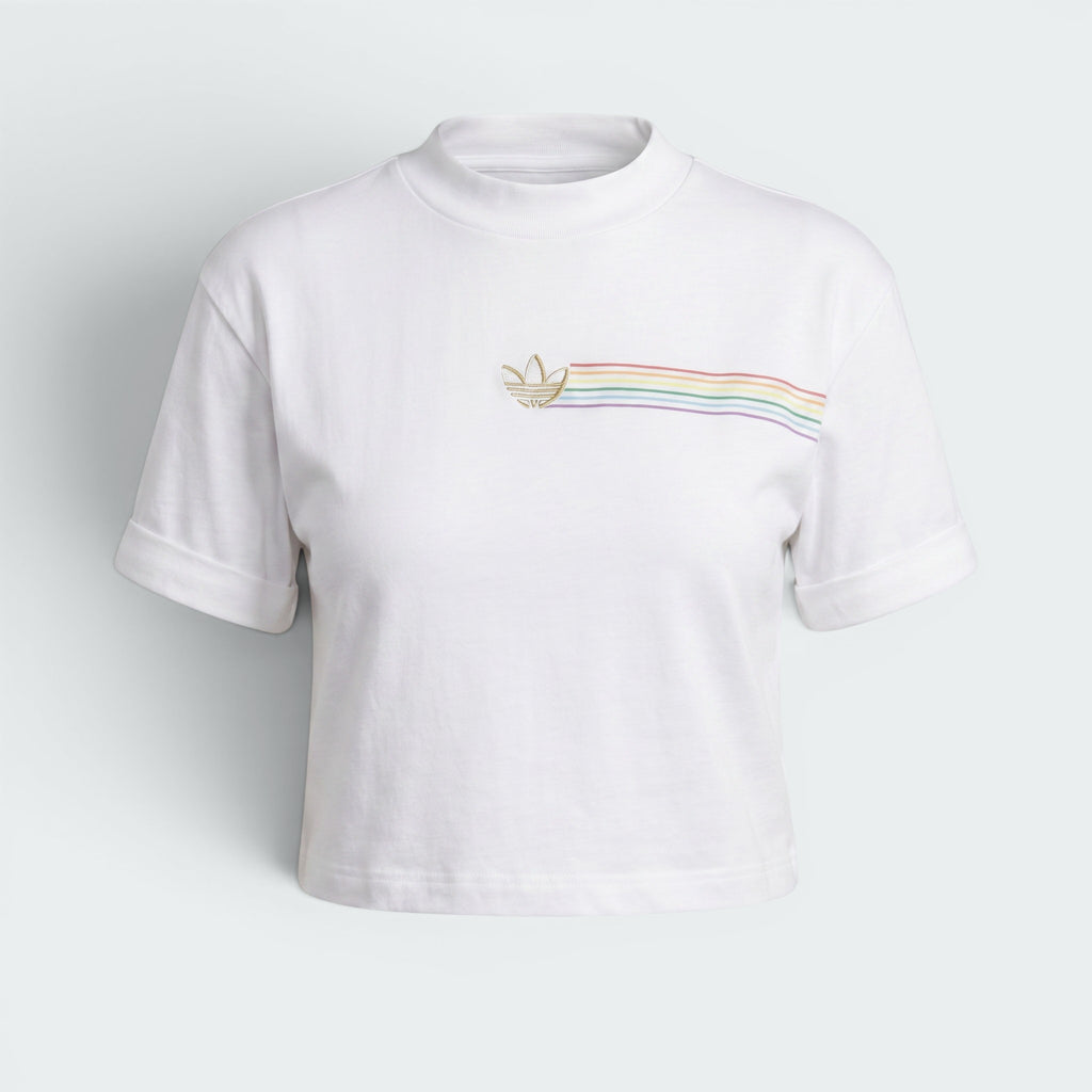 Focuses on the clean symmetry of the flat-laid crop tee, displaying the perfect layout of the ribbed crewneck collar, the short sleeve tracks, and the centered alignment of the multi-coloured front logo.