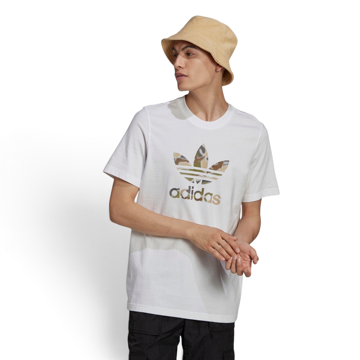 Highlights the high-velocity sweep of the central graphic print, showing the professional, clean texture of the white fine knit cotton body and the sharp contrast of the multi-colour spray-paint styling across the chest. Main image