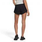 adidas Adicolor 3-Stripes Women's Shorts GN2885 worn seated or during movement showing comfort and flexibility from the rear