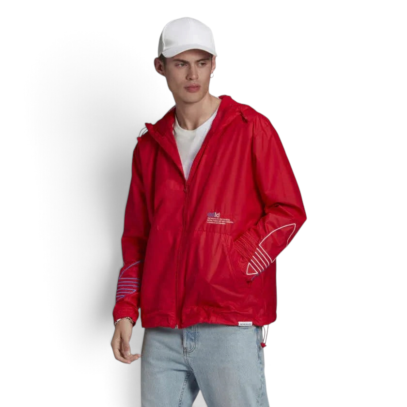 Trade Sports model wearing a scarlet Adidas Originals Adicolor windbreaker with white and blue sleeve details.