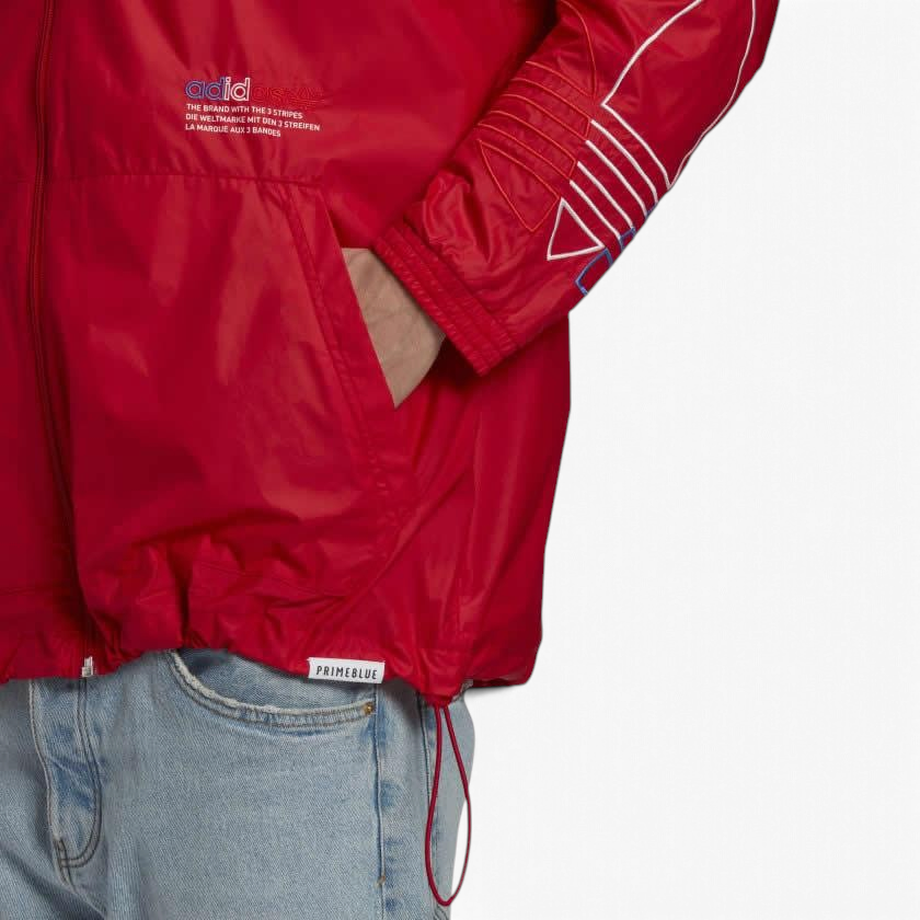 Trade Sports Adidas Originals windbreaker in scarlet red with white sleeve detailing and a Primeblue hem tag.