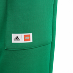 Close-up of adidas x LEGO Kids' Fleece Track Pants GN6803 elastic waist with LEGO logo