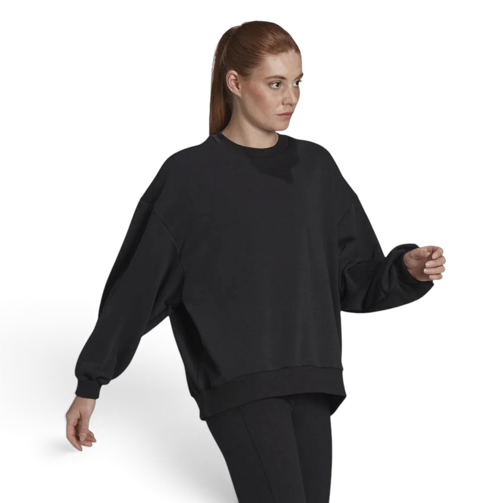 Highlights the loose, draped silhouette and the clean finish of the black French terry. Main image