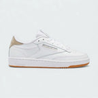 Reebok Classic Club C 85 women's trainers in white leather, side profile showing the iconic low-cut silhouette, cushioned midsole, and Reebok window logo.