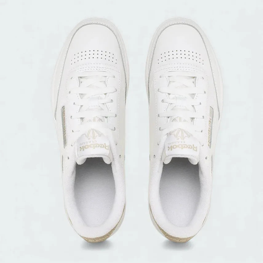 Top-Down view of a pair of Reebok Classic Club C 85 women's trainers in white, highlighting their clean shape and lace-up closure.